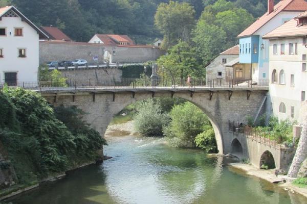 Bridge over Selška Sora leading to the historic part of the city of Škofja Loka