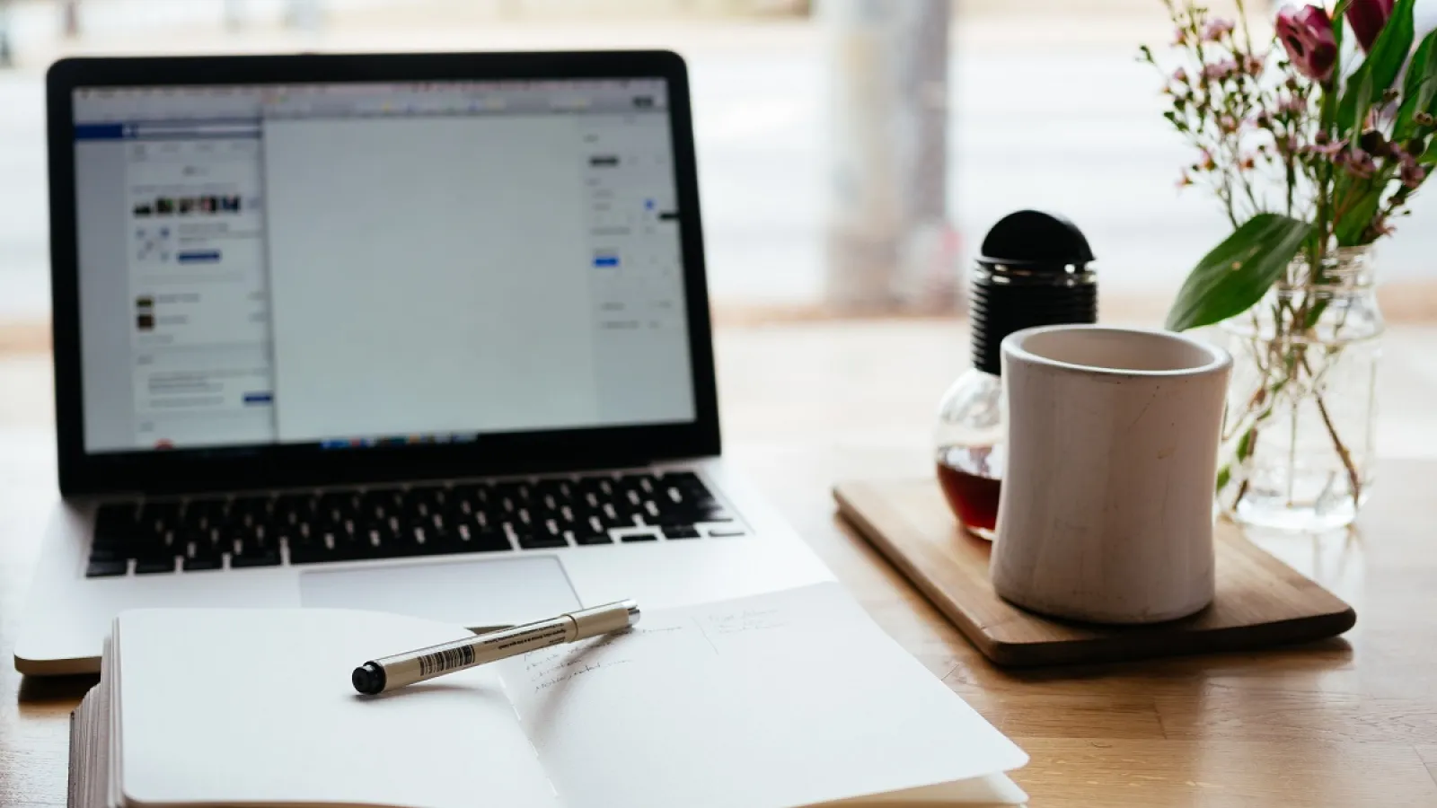 computer and planner on a desk