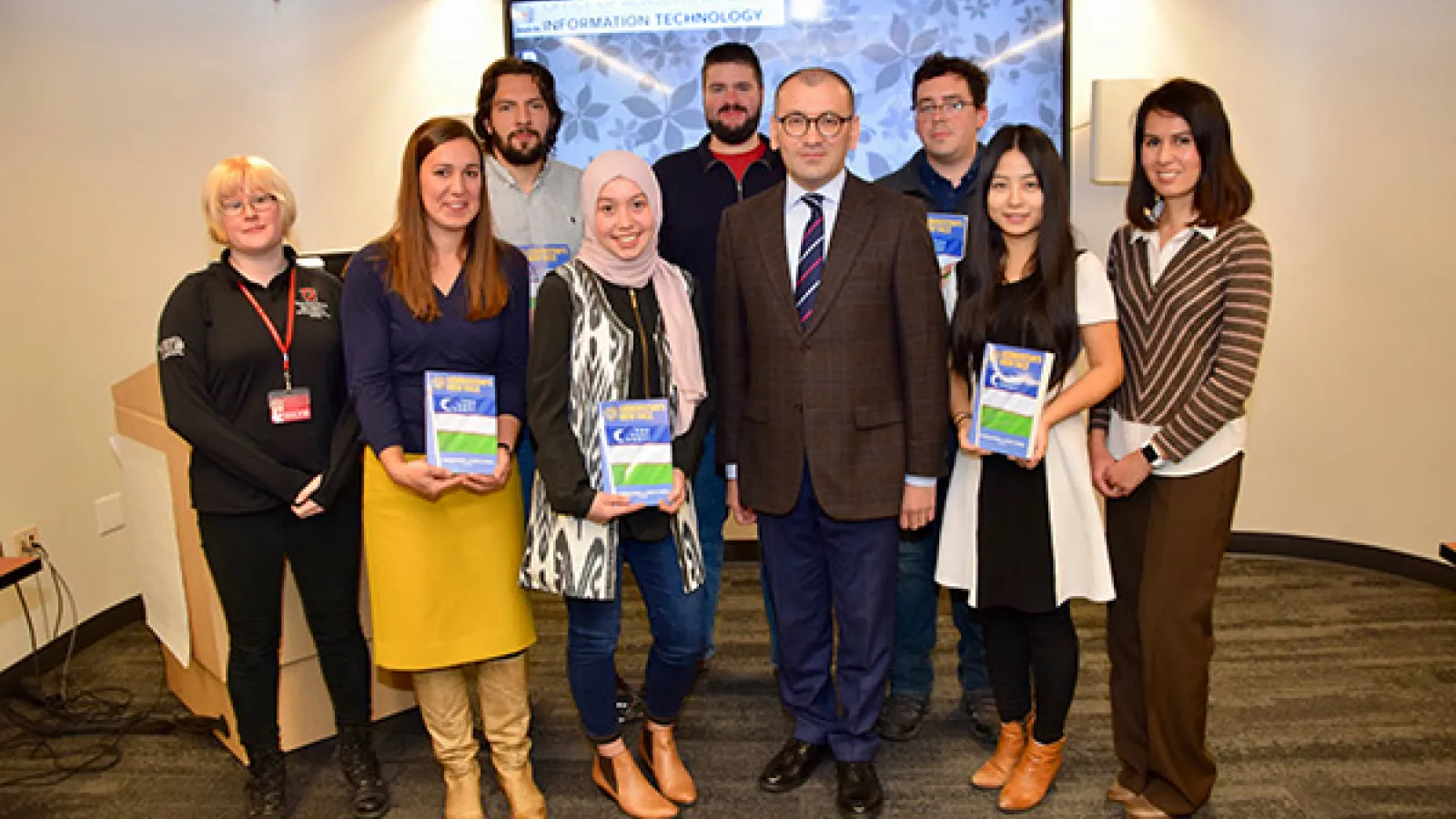 Group of students holding books