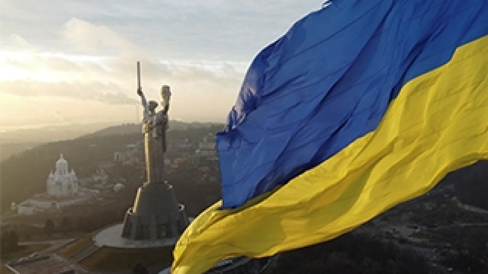 Ukrainian flag and statue