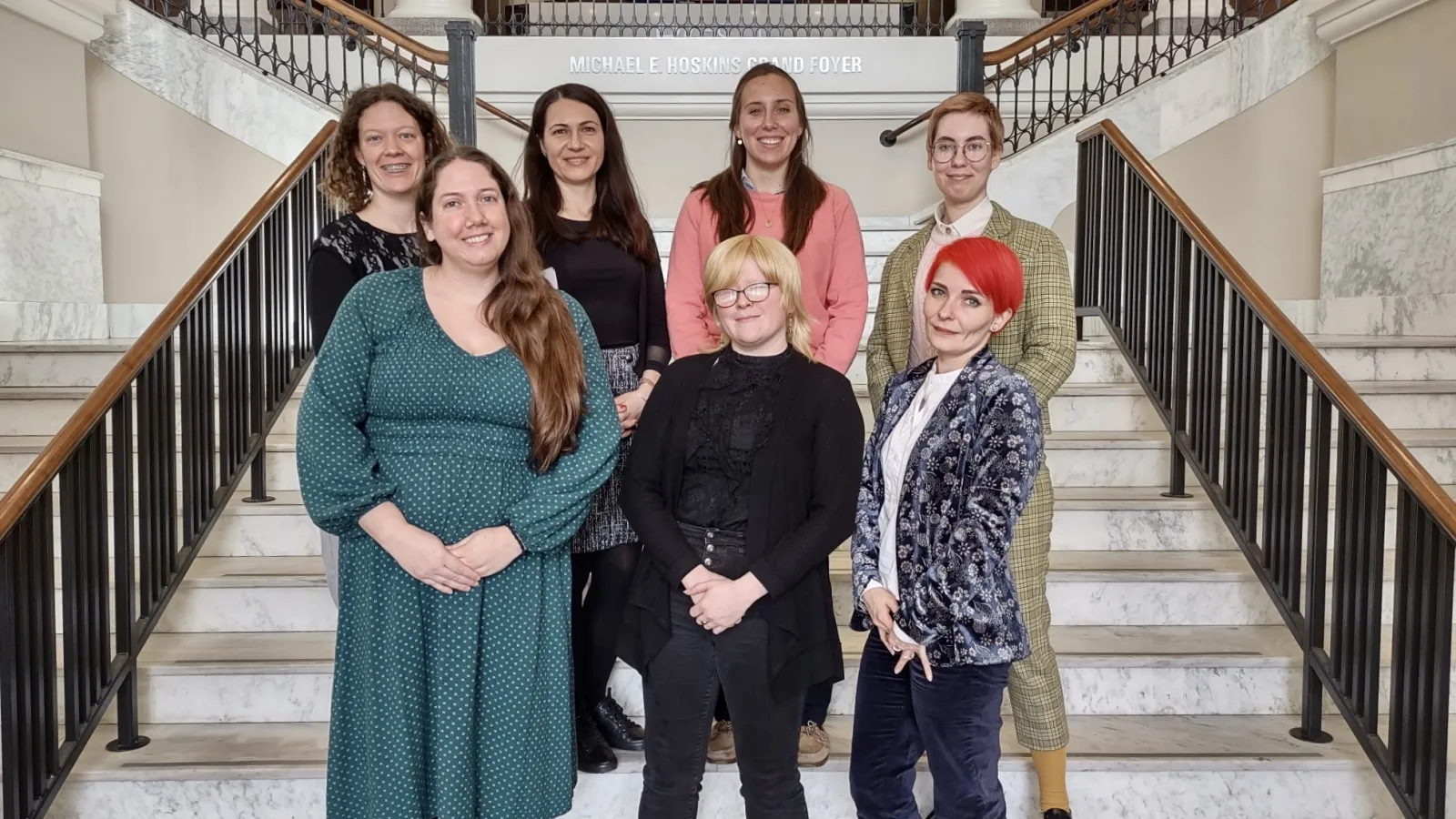 Ohio State olympiada volunteers standing on stairs inside of Bowling Green State .'s University hall. (Top row, left to right: Lilia Caserta, Lejla Veskovic, Siobhan Seigne, Michelle Verbitskaya Bottom row, left to right: Emma Pratt, Alicia Baca, Aleksandra Shubina