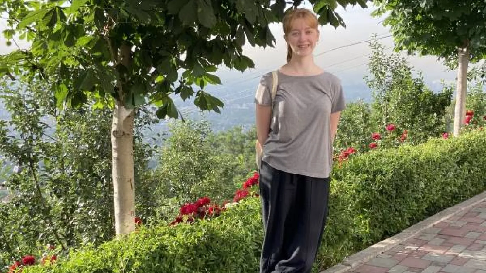 The author Sophie Papp at Kok-Tobe Park, surrounded by greenery.