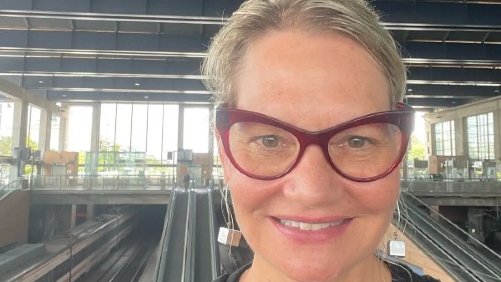 Larissa Abramiuk (blonde hair, red cat-eye glasses) on the Metro in Cordoba, Spain