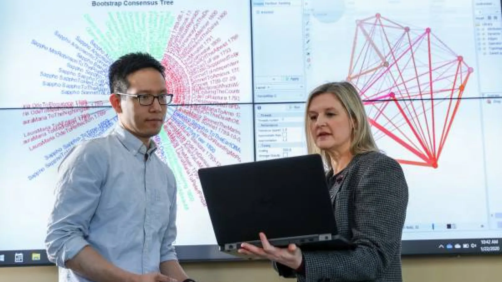 Two researchers present data in the Research Commons