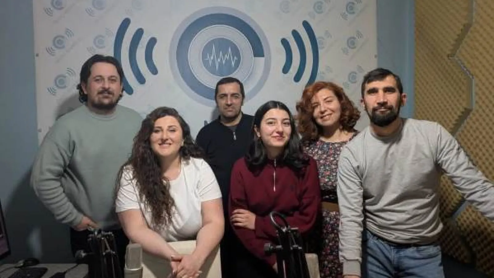 The Radio Marneuli team of six journalists pose in their studio