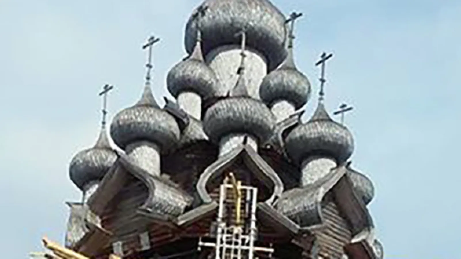 Grey wooden onion domes of an Orthodox church
