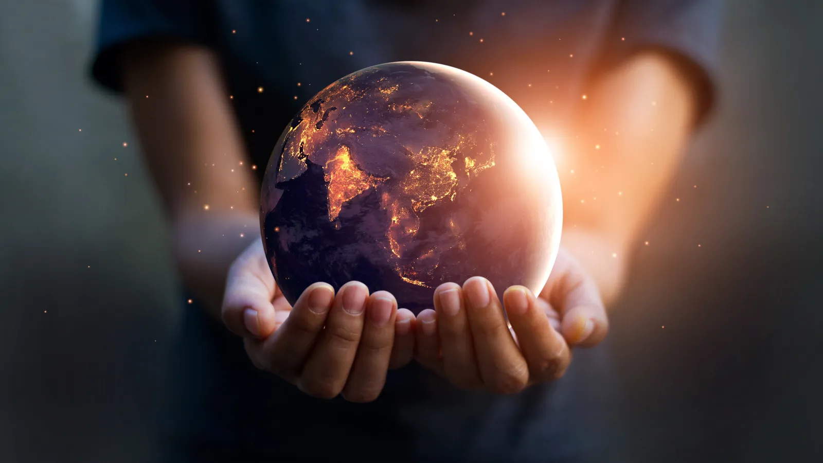 child holding polluted planet Earth