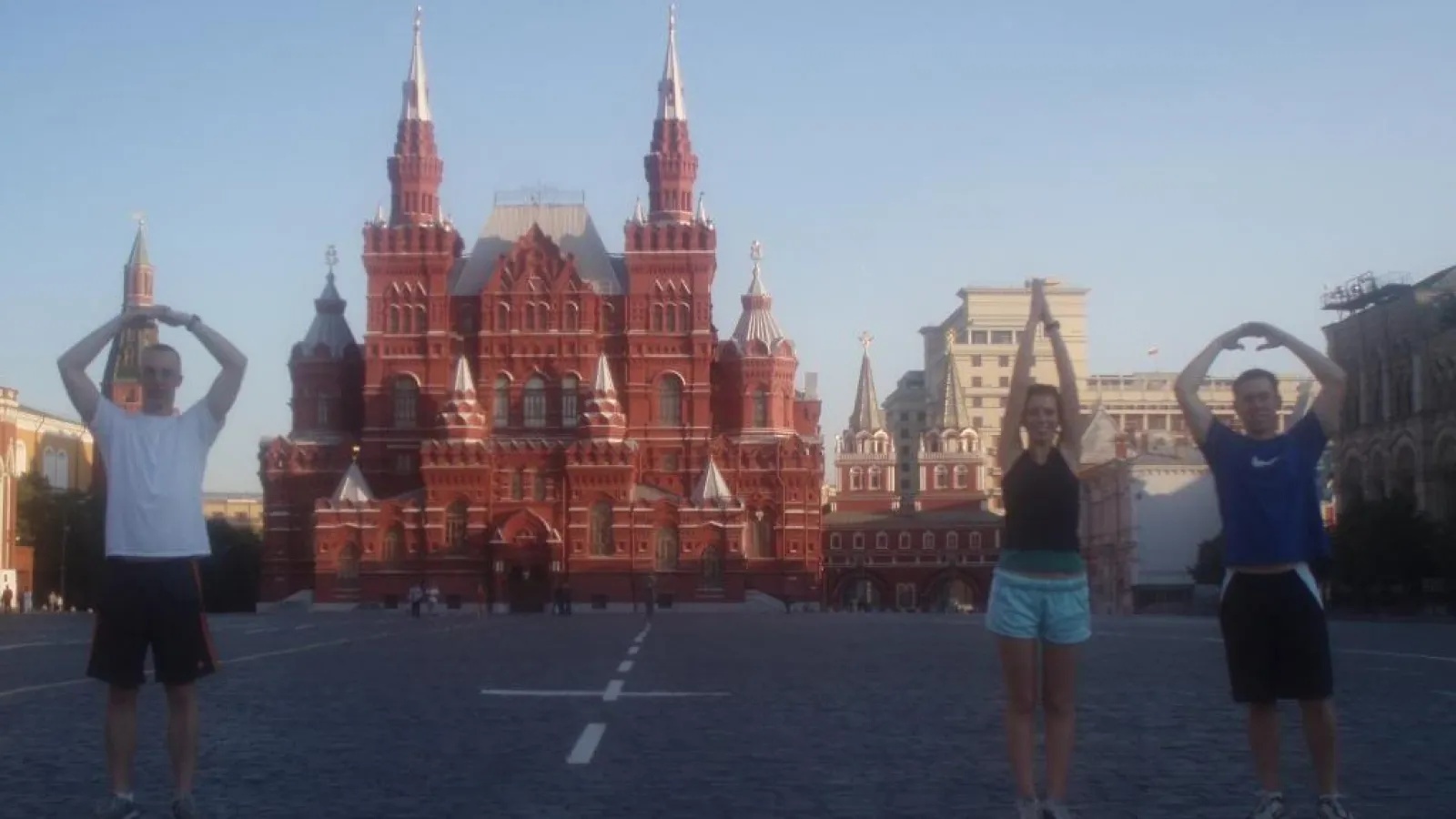 3 students standing in O-H-I-O on Red Square