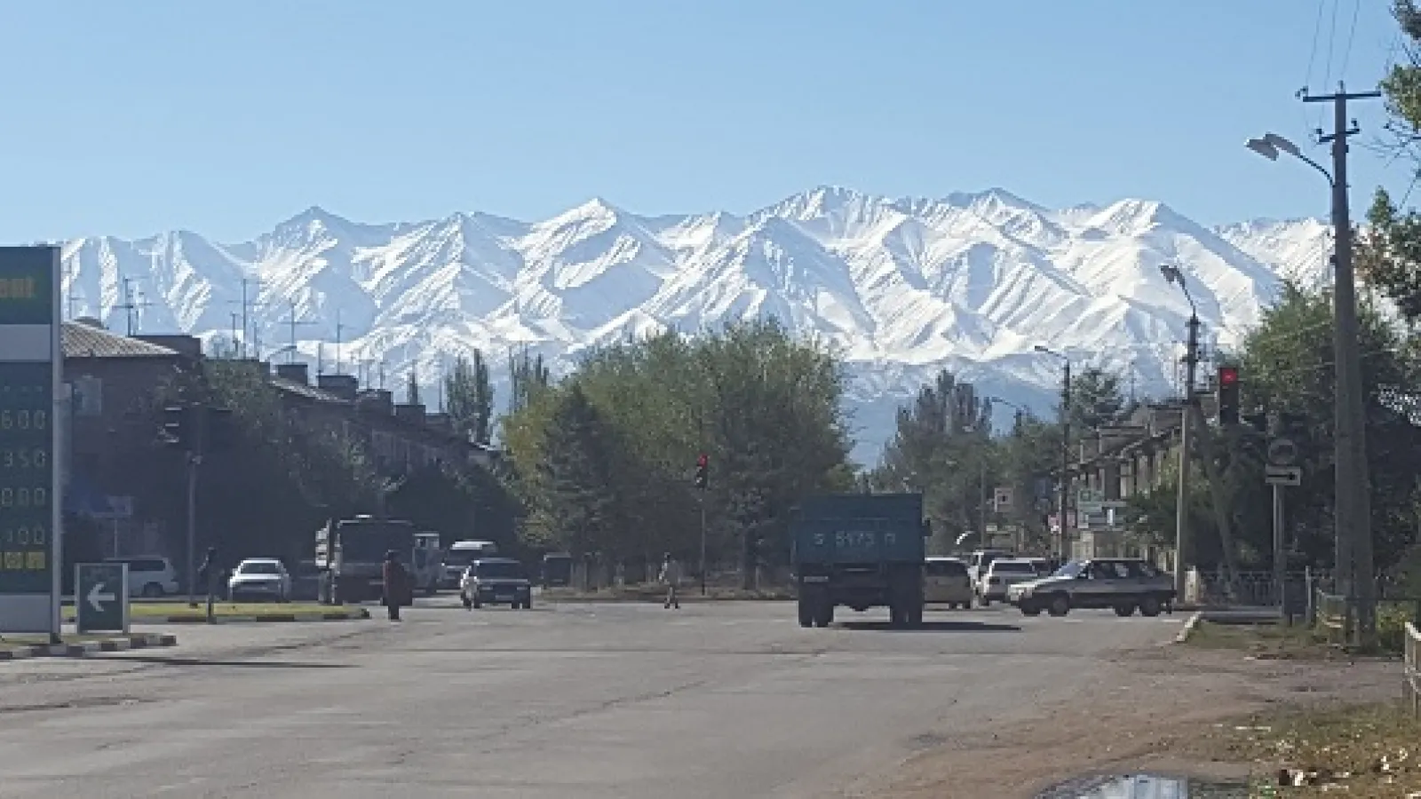 road and snow covered mountains