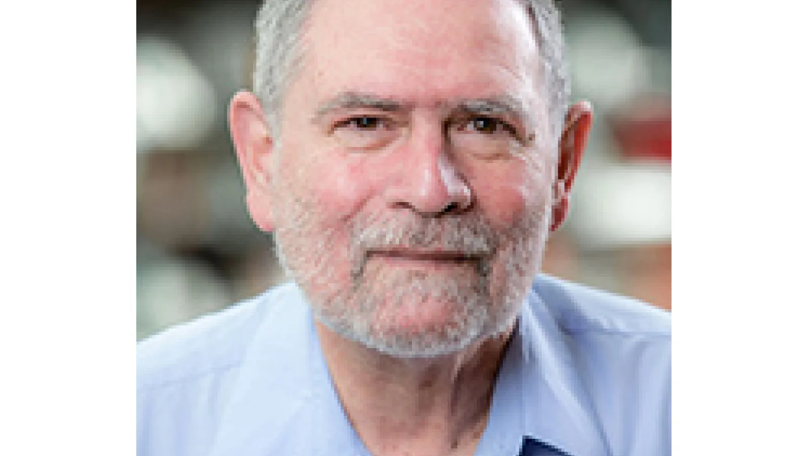 Close up photo of man's upper body and face bordered in white