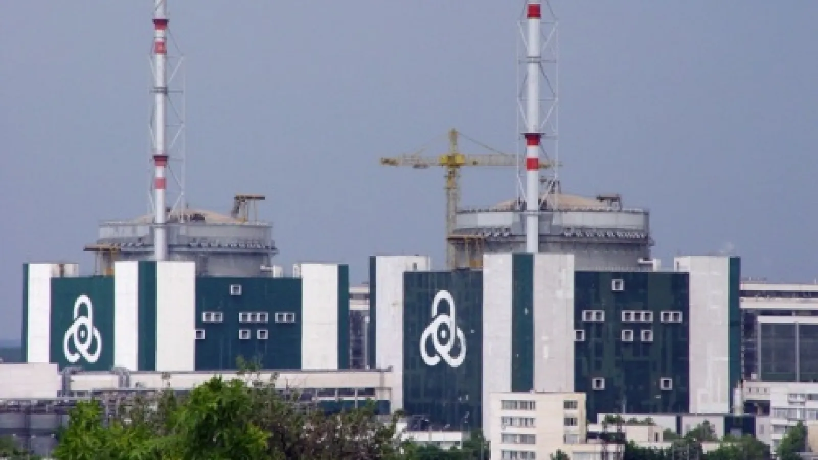 Picture of two nuclear smoke stacks from afar