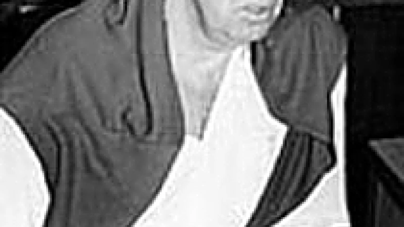 Black and white image of man's face and upper torso