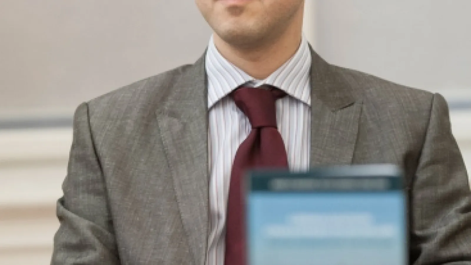 Dr. Umut Korkut at a desk