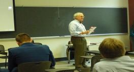 Man standing in a classroom