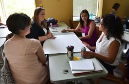 Teachers participating in a brainstorming exercise teachers participating in a brainstorming exercise