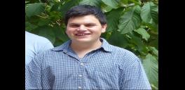 Chris Guerrini Man wearing a blue checked shirt looking at the camera