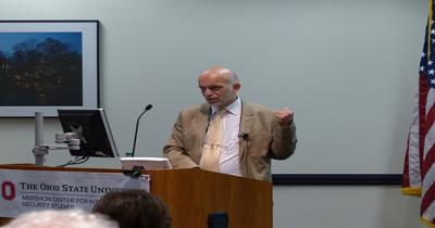 Georgian Ambassador Archil Gegeshidze Man standing at podium talking