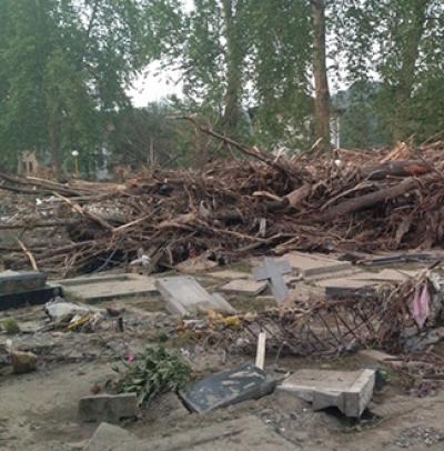 Flooded Village in Bosnia Debris from flood in a pile