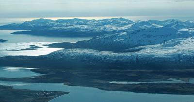 A distance shot of the mountains and a bay