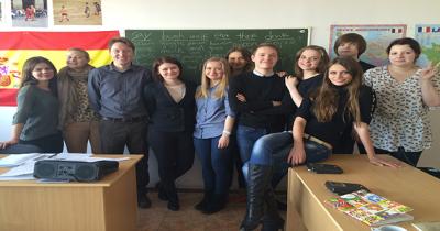 Eric with English Language Students Large group of students standing in front of classroom