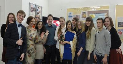 Eric with English Language Students Large group of students standing in front of classroom