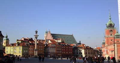 View looking across a large public square with old brick buildings on other side