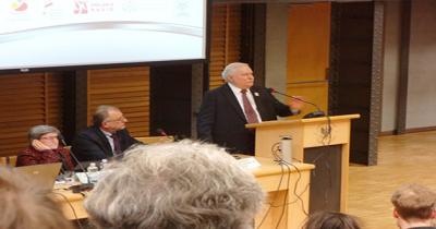 Keynote Speech by Lech Walesa at the University of Warsaw Man standing at podium speaking into microphone on stage
