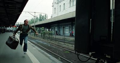 From the Film "Blind Chance" Man running to a platform to catch a leaving train