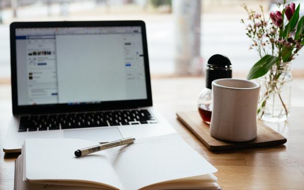 computer and planner on a desk