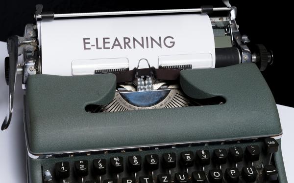 A typewriter with a piece of paper that says elearning