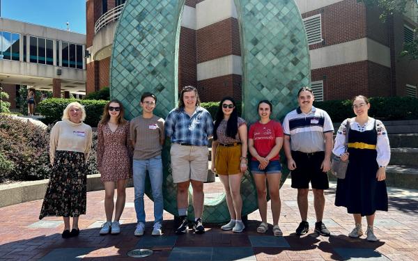 CSEEES MA students in front of the Oxley number statues