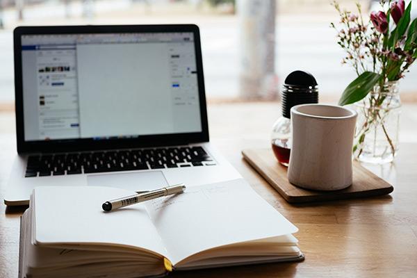 Open laptop and book