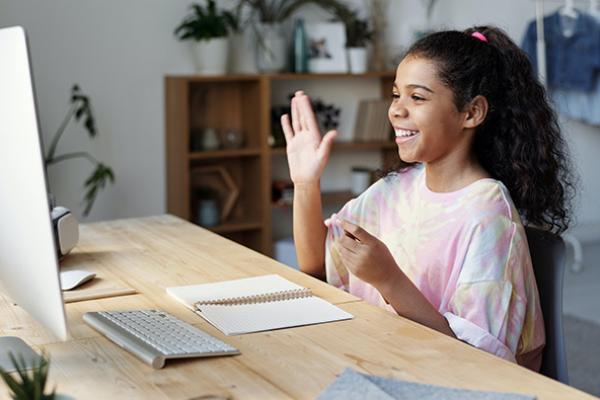 Student studying online at computer