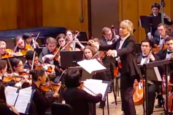 Symphony performers playing a piece of music