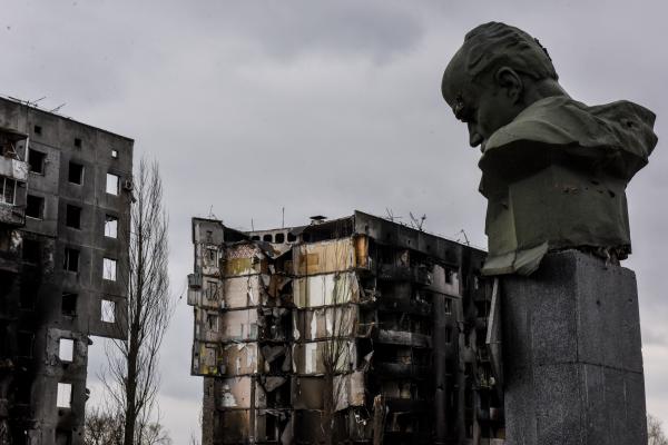 Bust of Taras Shevchenko in front of the remains of buildings in in Borodyanka. 