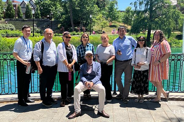 Group photo of the US-CARNET delegation and Ohio State faculty and staff in front of Mirror Lake