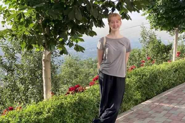 The author Sophie Papp at Kok-Tobe Park, surrounded by greenery.