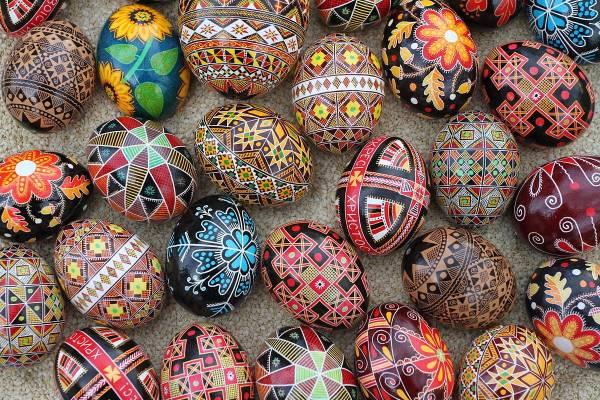An assortment of colorful eggs decorated in Ukrianian wax relief with both traditional and modern motifs