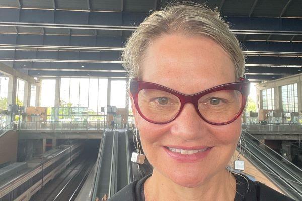 Larissa Abramiuk (blonde hair, red cat-eye glasses) on the Metro in Cordoba, Spain