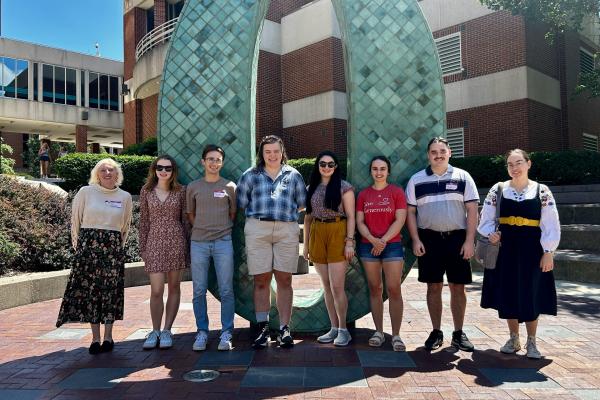CSEEES MA students in front of the Oxley number statues