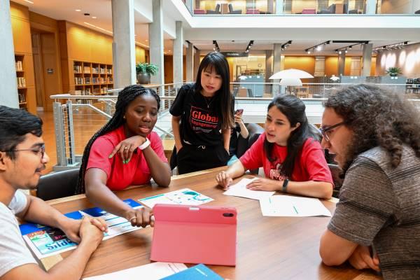 A group of students work together in Thompson Library