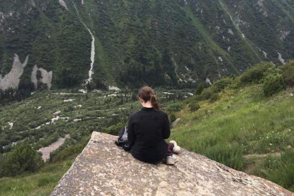 Amelia Smith in Kyrgyzstan Amelia Smith enjoying the view off a mountain in Kyrgyzstan