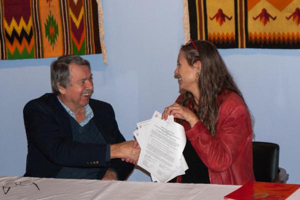 Dr. Angela Brintlinger and UMA Director Andrew Fedynsky with signed Memorandum of Understanding 