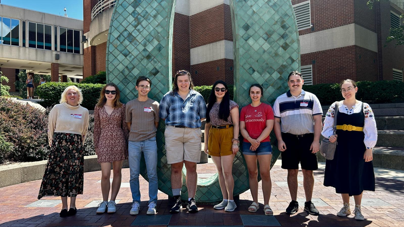 CSEEES MA students in front of the Oxley number statues