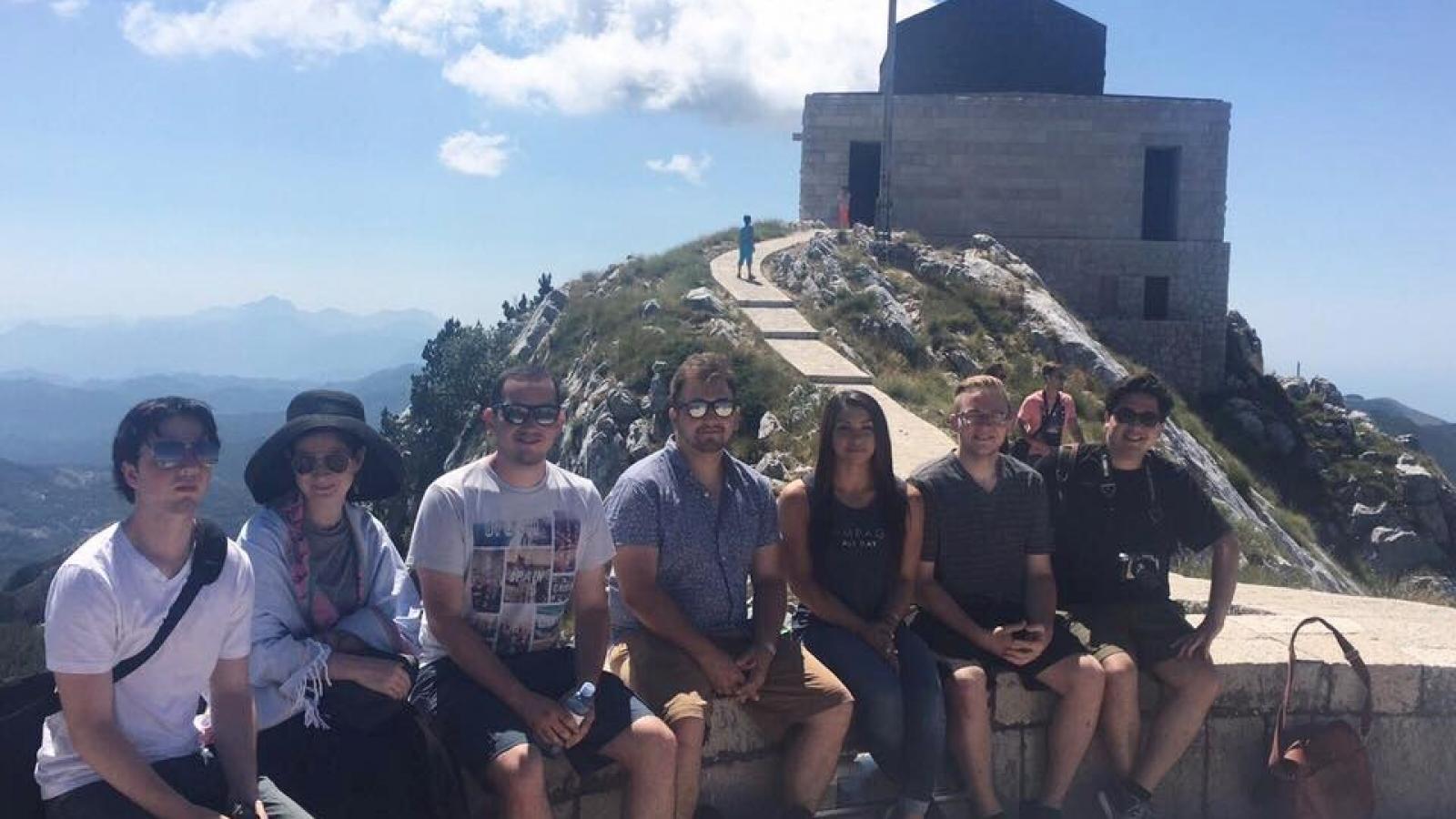 Students sitting on top of Mount Lovcen